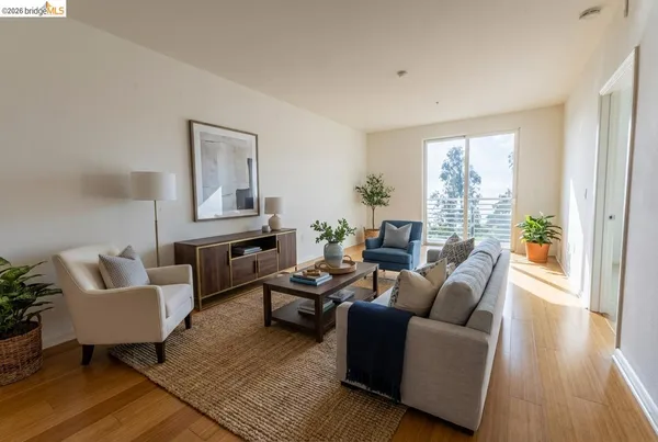a kitchen with granite countertop a stove top oven a sink dishwasher and cabinets with wooden floor