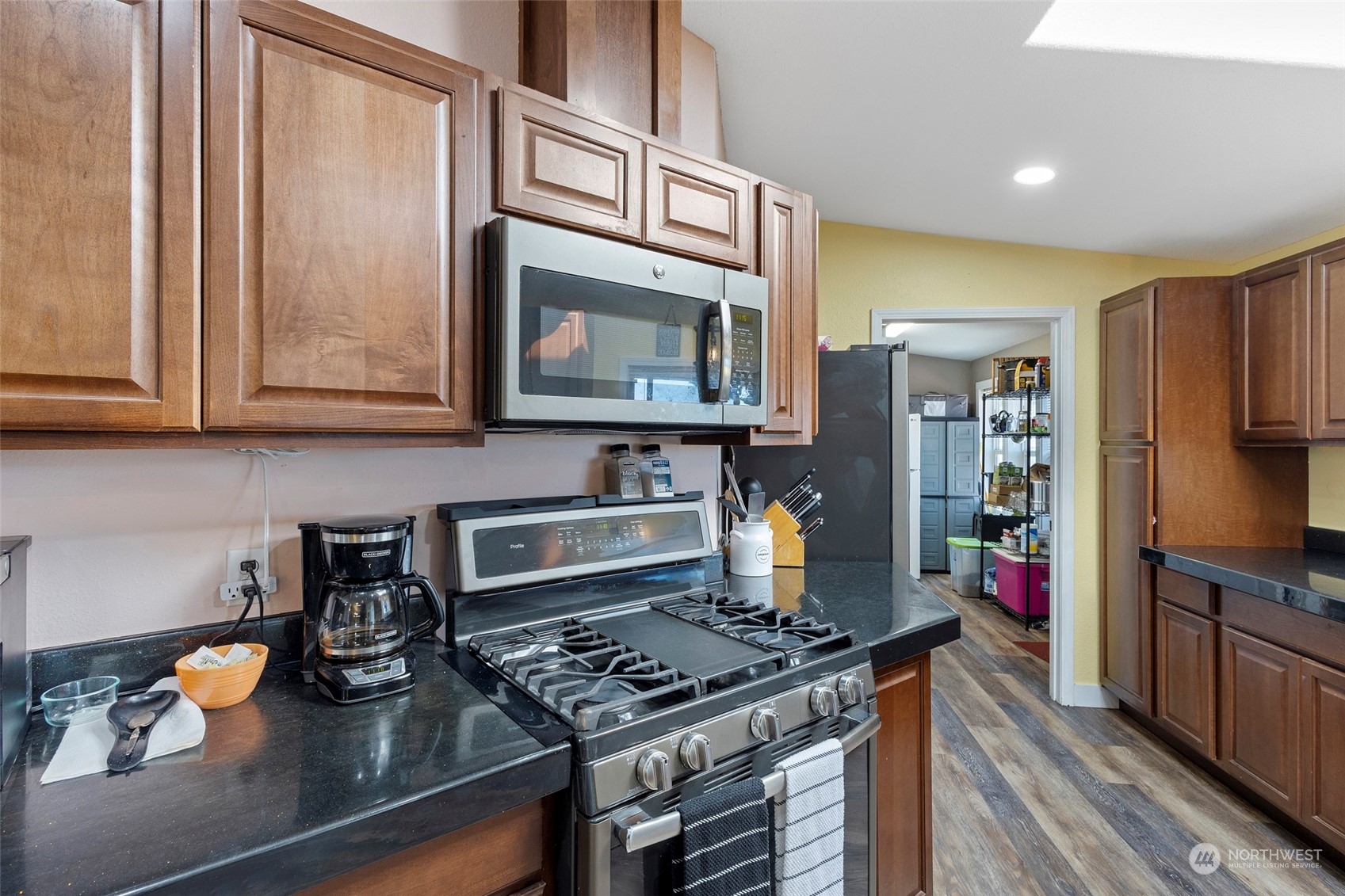 13846 Avon Allen Road Mount Vernon, WA 98273 - Photo 12 of 36 a kitchen with stainless steel appliances granite countertop a stove and a microwave