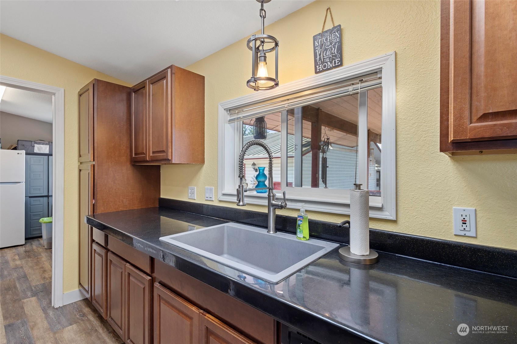 13846 Avon Allen Road Mount Vernon, WA 98273 - Photo 14 of 36 a kitchen with kitchen island granite countertop a sink and a stove