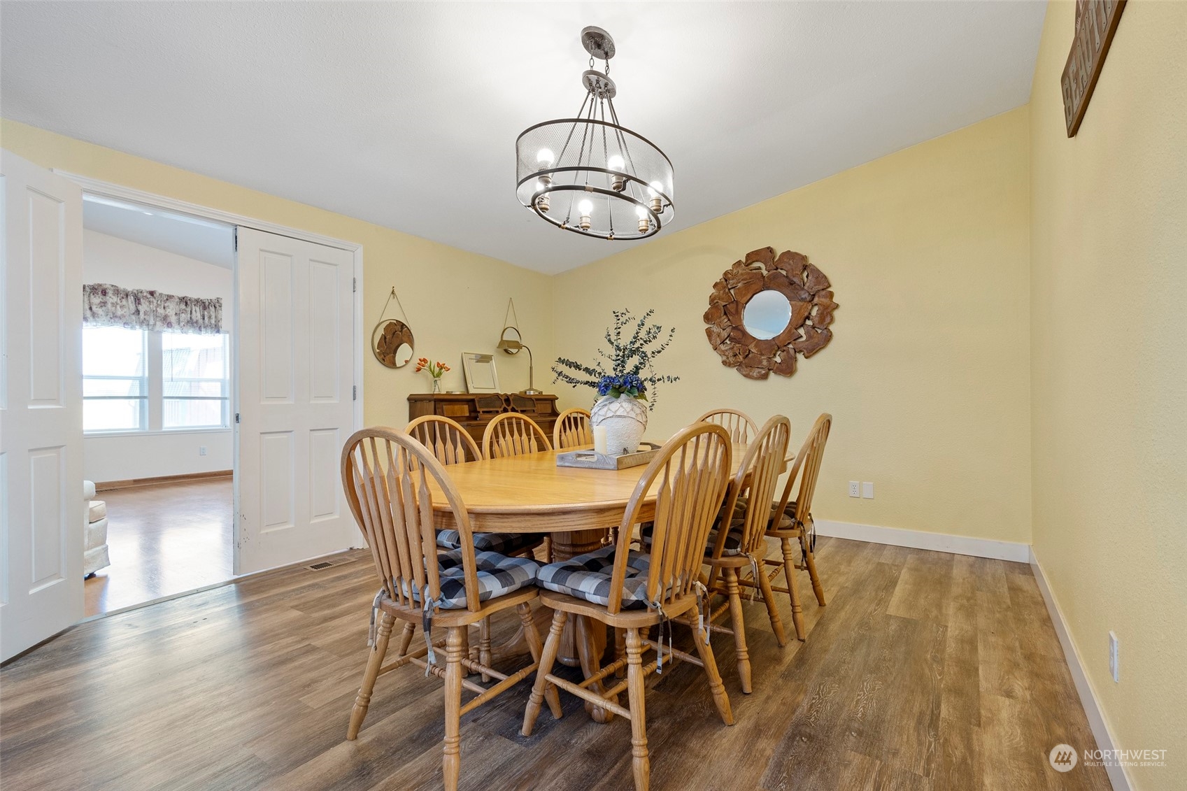13846 Avon Allen Road Mount Vernon, WA 98273 - Photo 17 of 36 a view of a dining room with furniture and wooden floor
