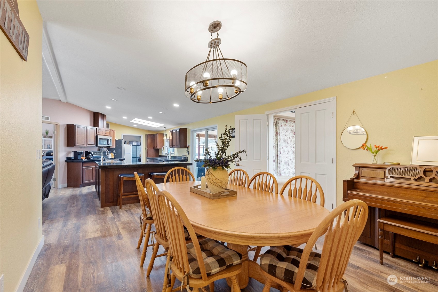13846 Avon Allen Road Mount Vernon, WA 98273 - Photo 18 of 36 a view of a dining room with furniture and wooden floor