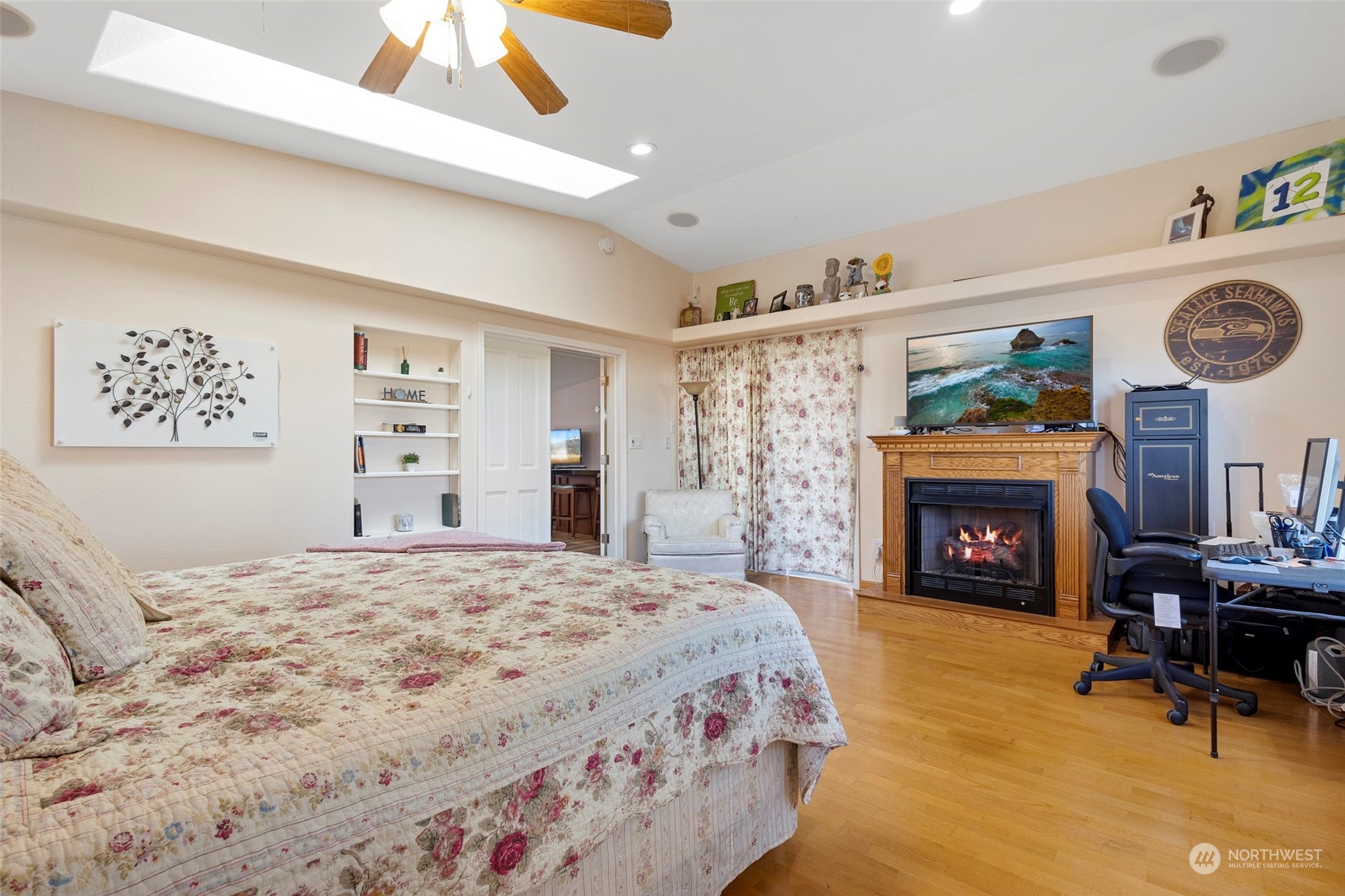 13846 Avon Allen Road Mount Vernon, WA 98273 - Photo 20 of 36 a bedroom with a bed and a fireplace