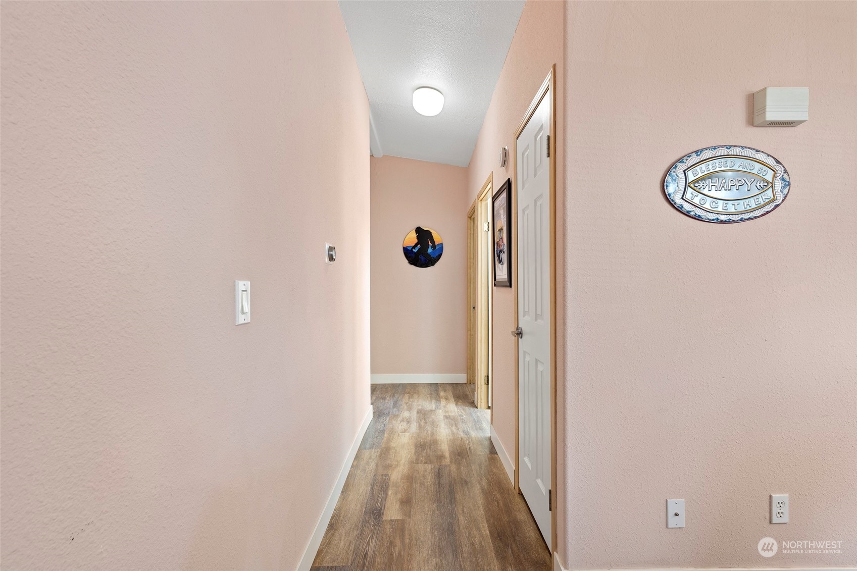 13846 Avon Allen Road Mount Vernon, WA 98273 - Photo 26 of 36 a view of a hallway with wooden floor