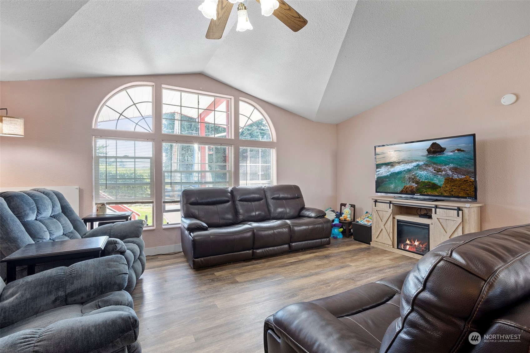 13846 Avon Allen Road Mount Vernon, WA 98273 - Photo 8 of 36 a living room with furniture a flat screen tv and a large window