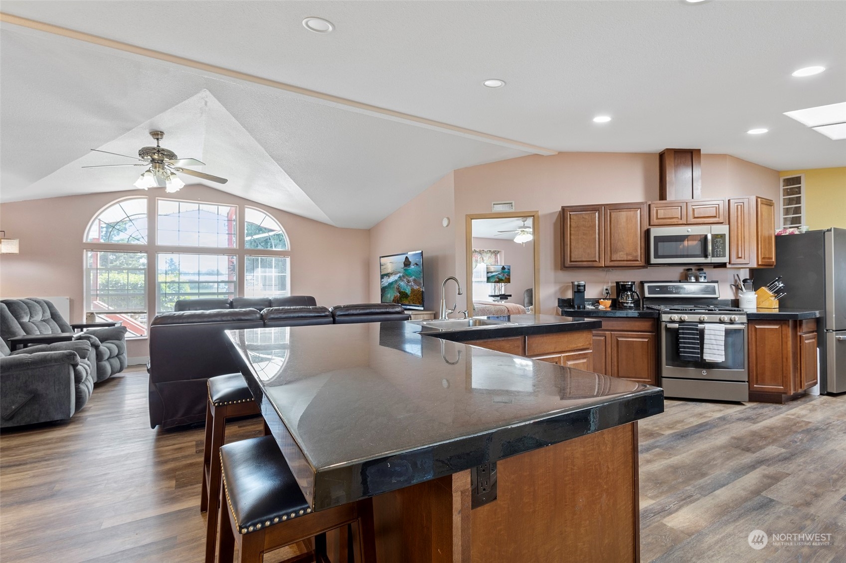 13846 Avon Allen Road Mount Vernon, WA 98273 - Photo 10 of 36 a large kitchen with kitchen island a dining table and chairs