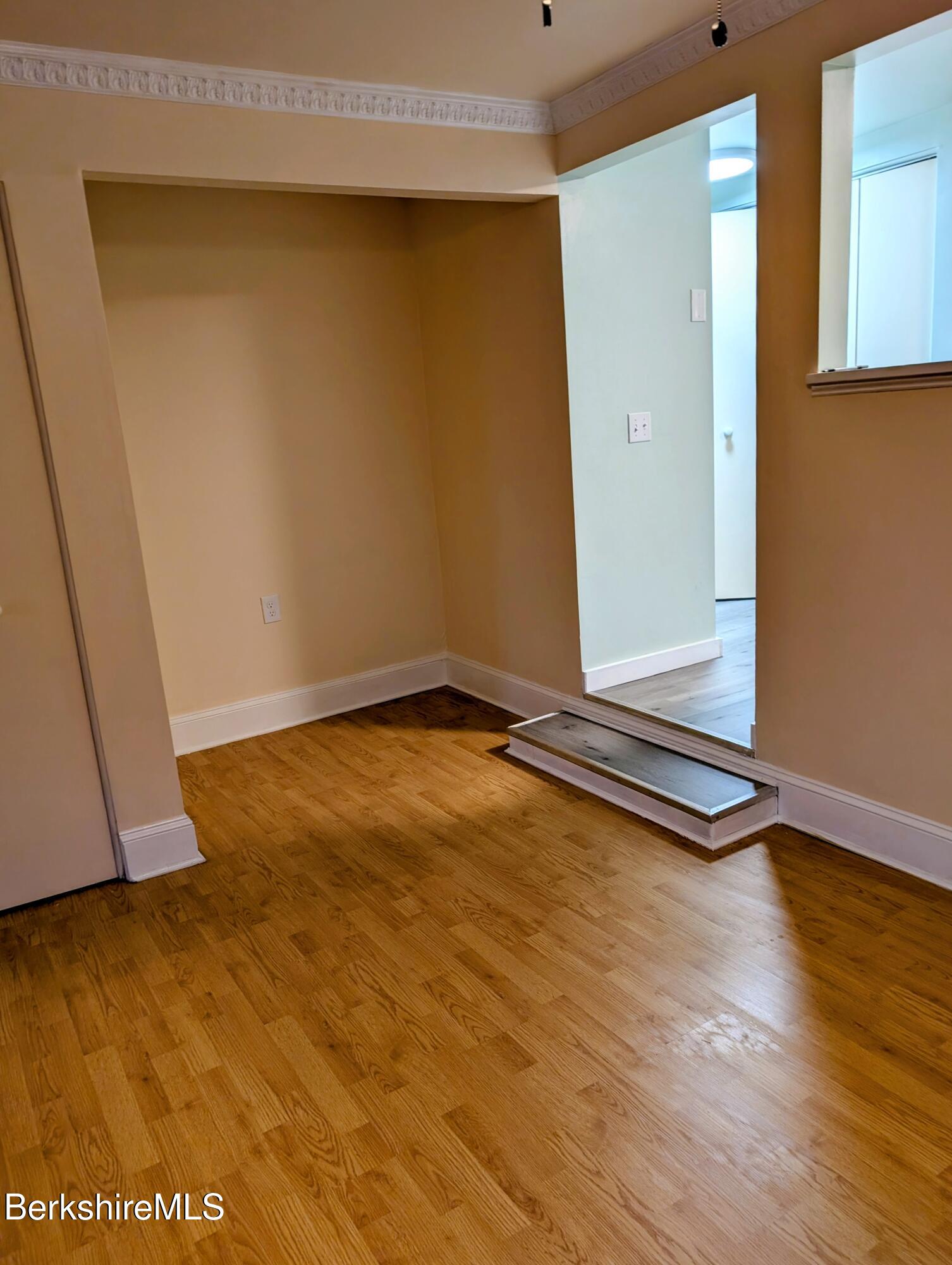 1 Pebble Street, Unit B North Adams, MA 01247 - Photo 8 of 14 a view of an empty room with wooden floor