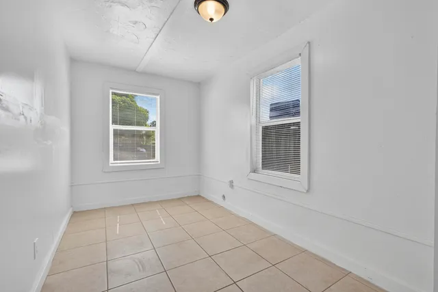 a view of an empty room with windows