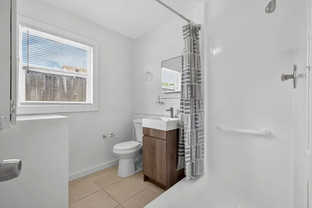 a bathroom with a toilet and a sink