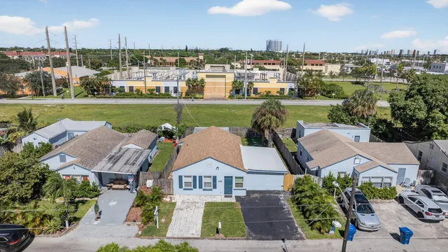 an aerial view of residential houses with outdoor space