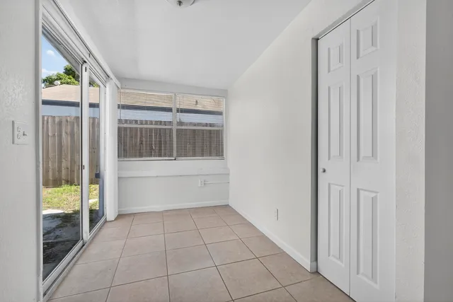 a view of empty room with windows