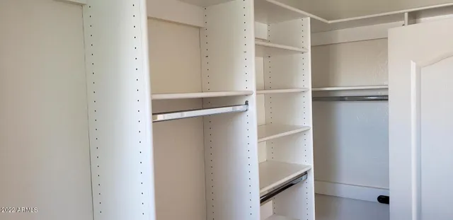a view of an empty walk in closet