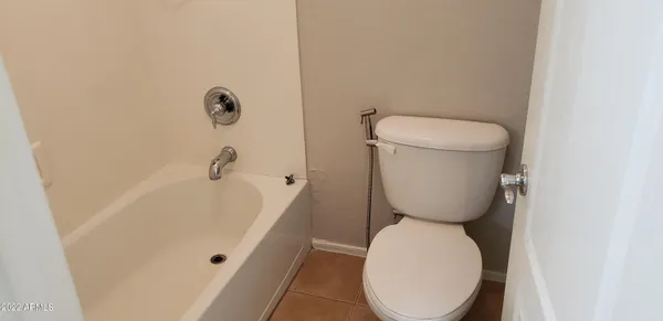 a bathroom with a toilet and a sink