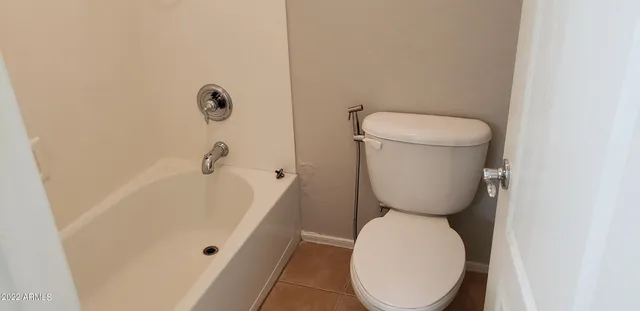 a bathroom with a toilet and a sink