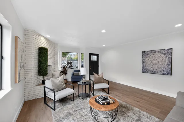 a living room with furniture and a rug