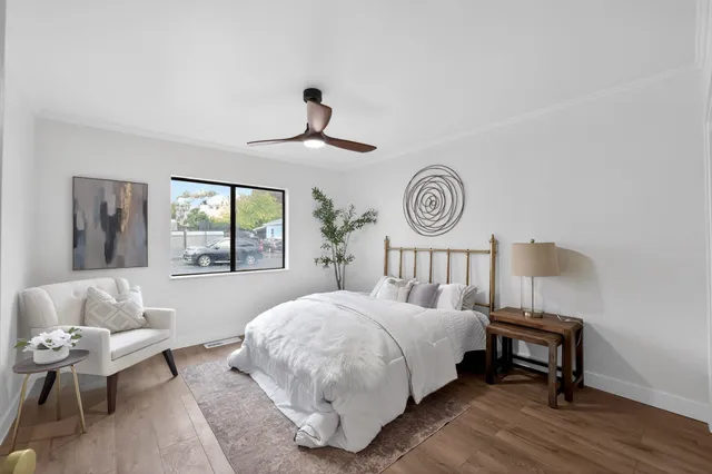 a bedroom with a bed and a window