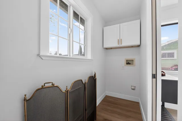 a room with cabinets and a wooden floor