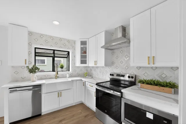 a kitchen with a sink stove and cabinets