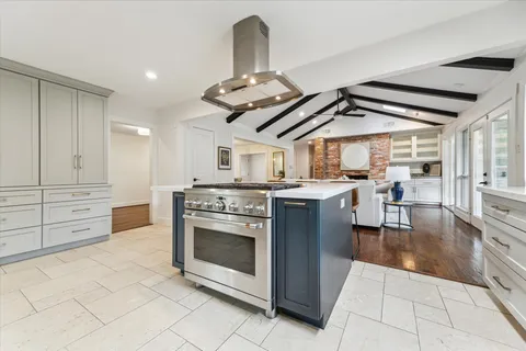 a kitchen with a sink stove and refrigerator