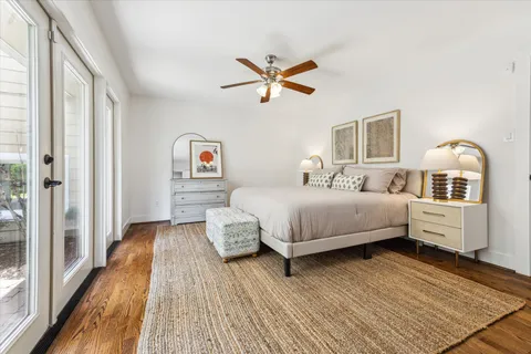 a view of walk in closet with wooden floor