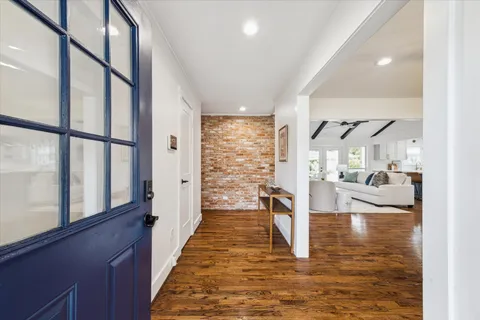 a view of a living room with a large window