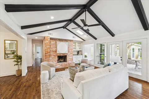 a living room with furniture or fireplace and wooden floor