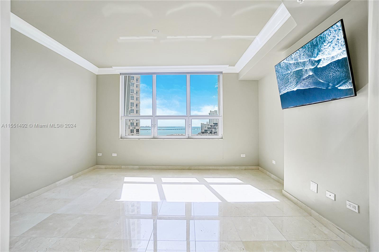 848 Brickell Key Drive, Unit 2003 Miami, FL 33131 - Photo 13 of 35 a view of an empty room with a window