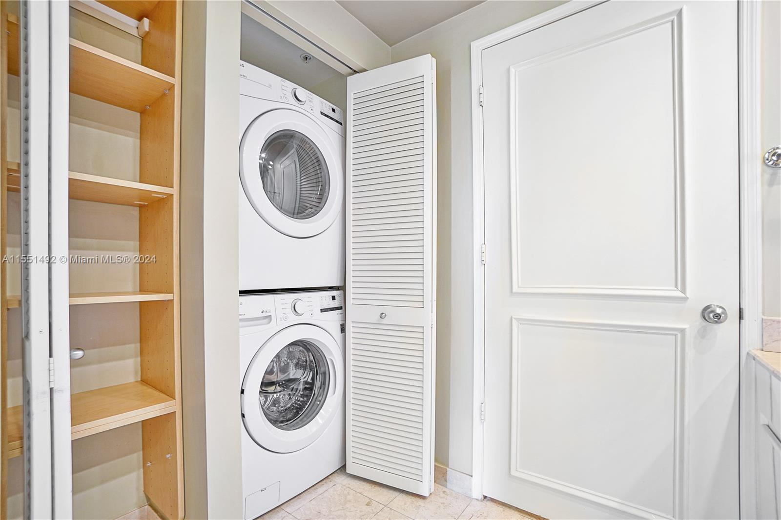 848 Brickell Key Drive, Unit 2003 Miami, FL 33131 - Photo 26 of 35 a view of washer and dryer in a utility room