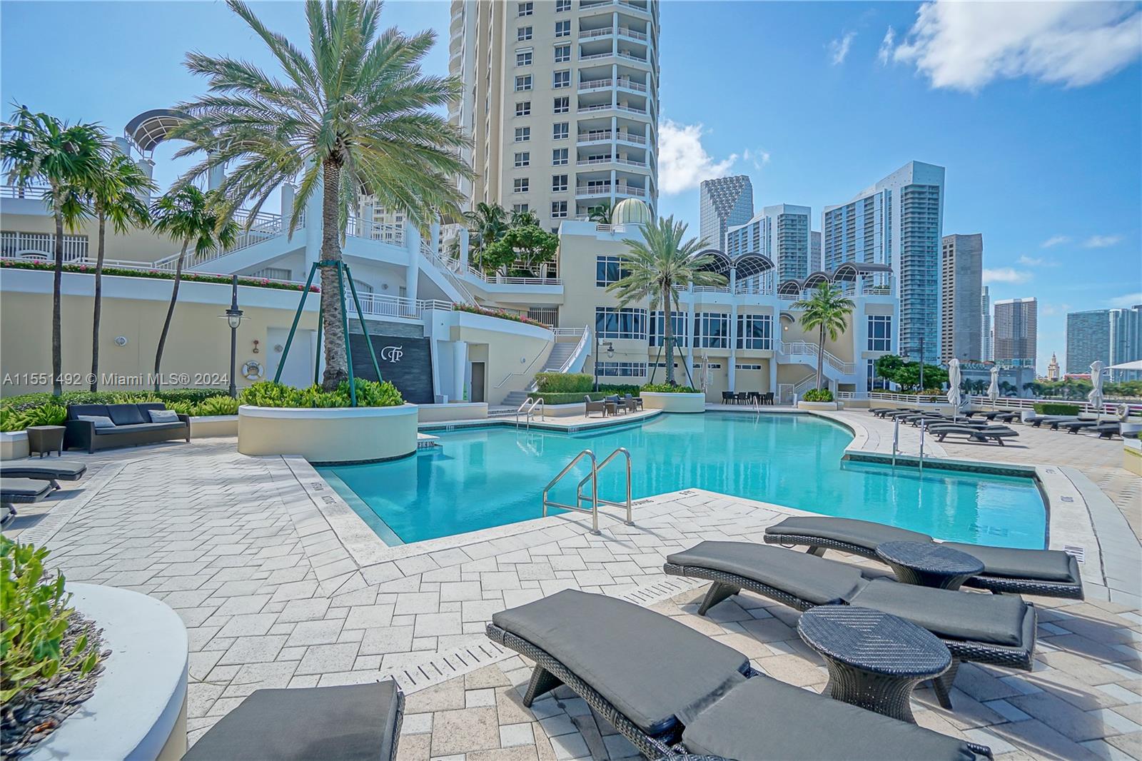 848 Brickell Key Drive, Unit 2003 Miami, FL 33131 - Photo 33 of 35 a view of pool with outdoor seating and city view