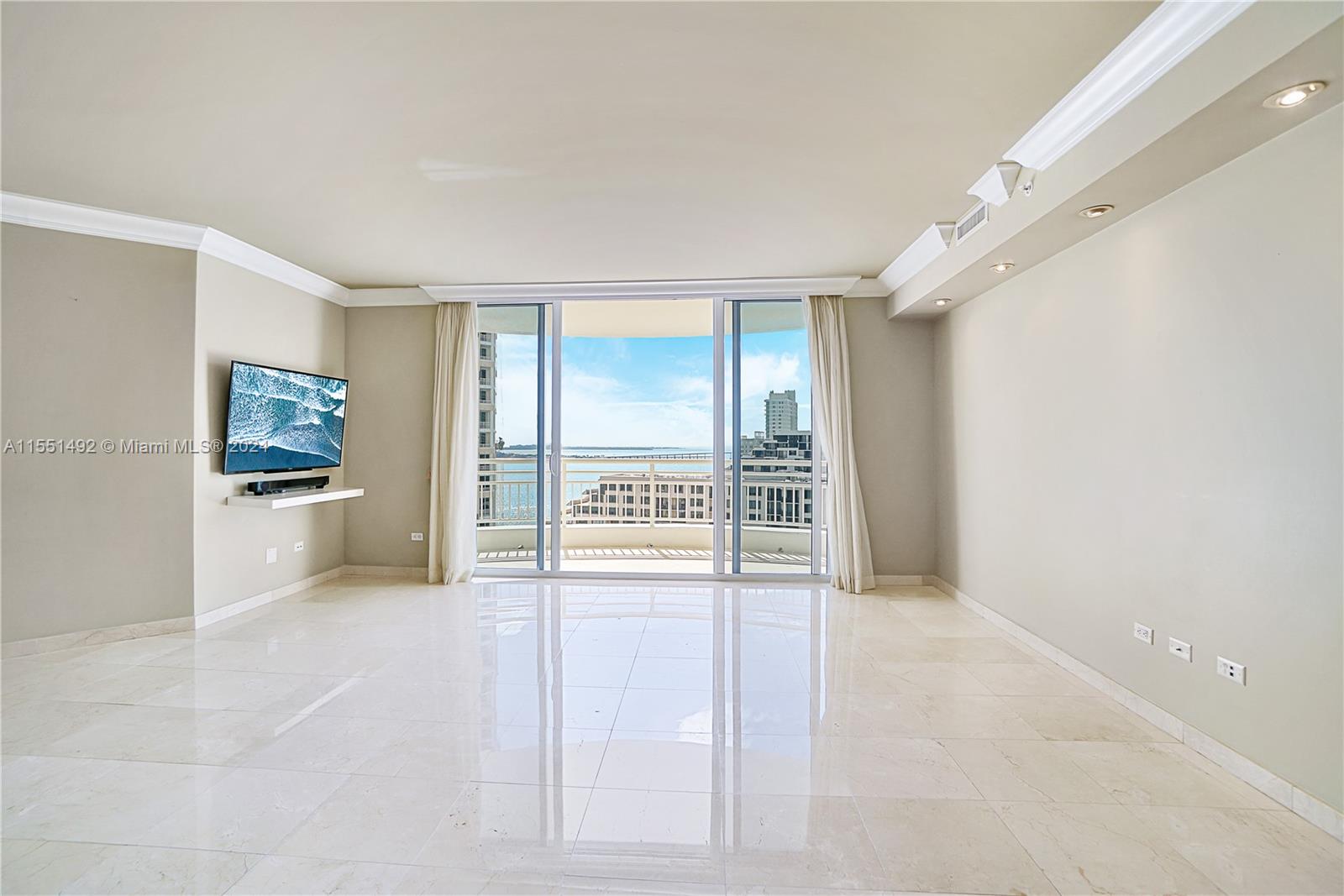 848 Brickell Key Drive, Unit 2003 Miami, FL 33131 - Photo 8 of 35 a view of an empty room with a window