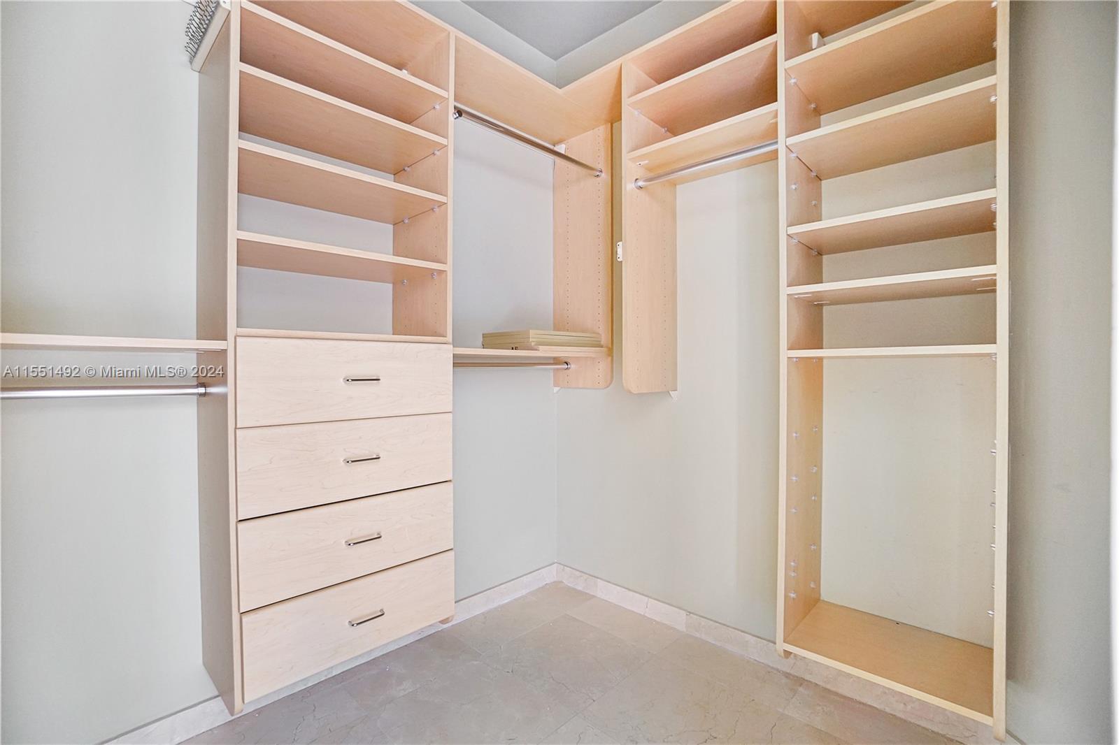 848 Brickell Key Drive, Unit 2003 Miami, FL 33131 - Photo 9 of 35 a view of an empty walk in closet