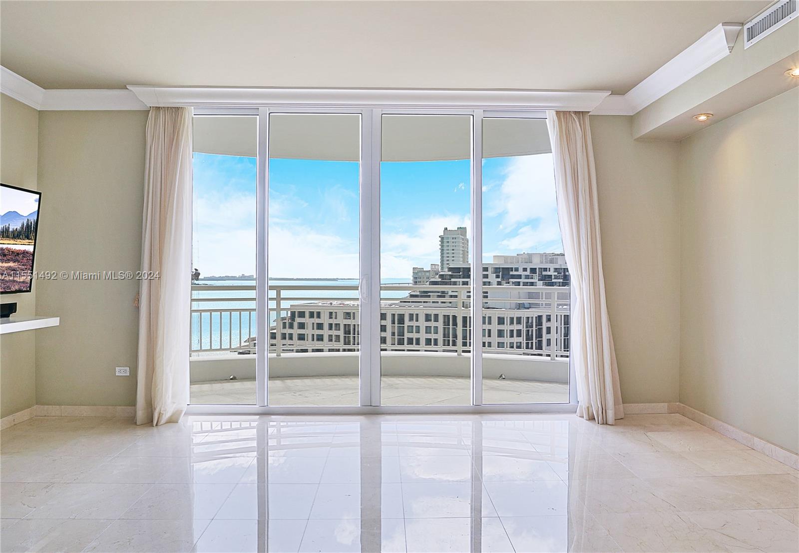 848 Brickell Key Drive, Unit 2003 Miami, FL 33131 - Photo 10 of 35 a view of a city from a porch