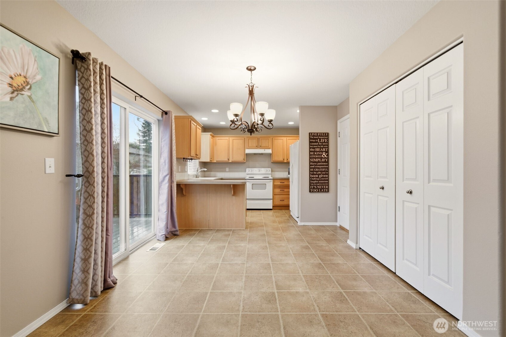 1205 Northeast 165th Way Ridgefield, WA 98642 - Photo 13 of 38 a view of a kitchen with a refrigerator and a sink