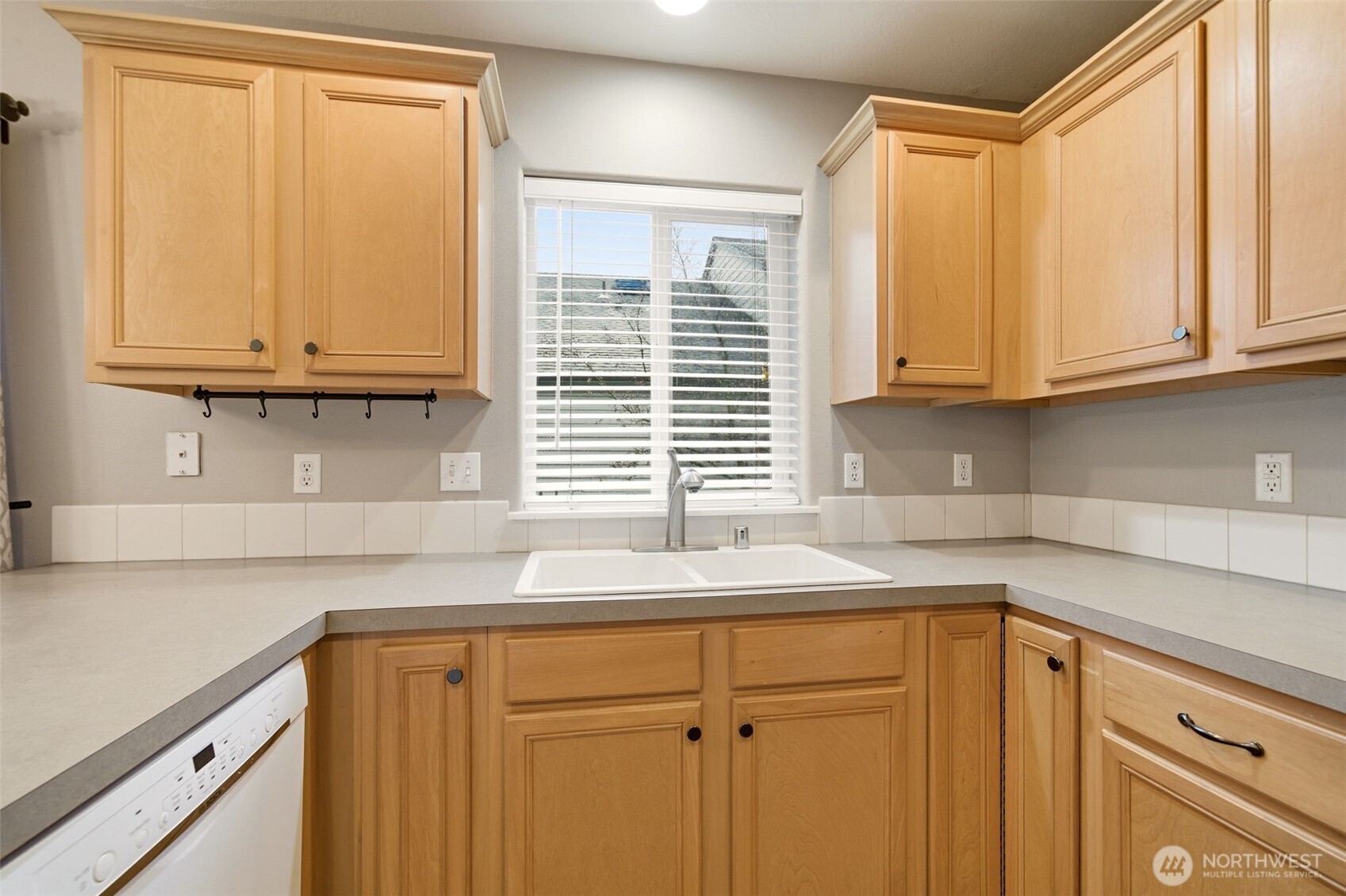 1205 Northeast 165th Way Ridgefield, WA 98642 - Photo 15 of 38 a kitchen with granite countertop cabinets and window