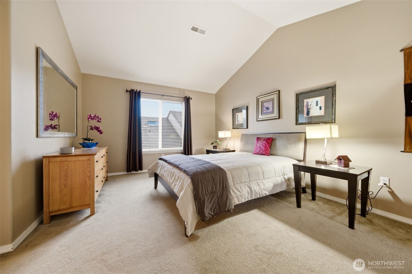 1205 Northeast 165th Way Ridgefield, WA 98642 - Photo 21 of 38 a spacious bedroom with a bed and dresser