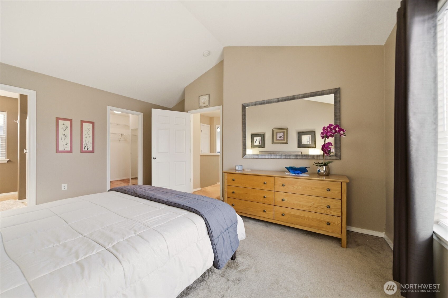 1205 Northeast 165th Way Ridgefield, WA 98642 - Photo 22 of 38 a bedroom with a bed dresser and mirror