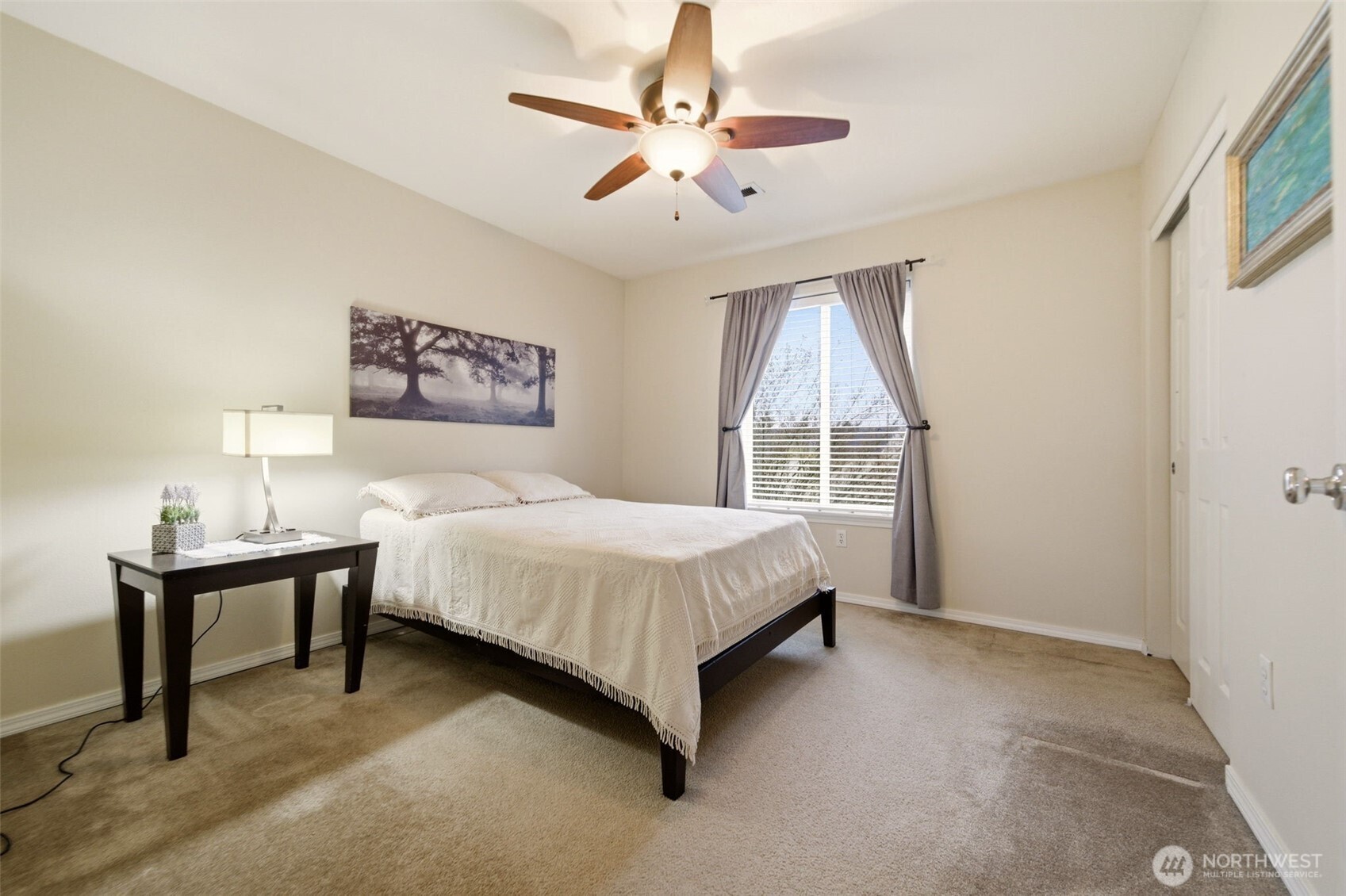 1205 Northeast 165th Way Ridgefield, WA 98642 - Photo 26 of 38 a spacious bedroom with a bed and a table
