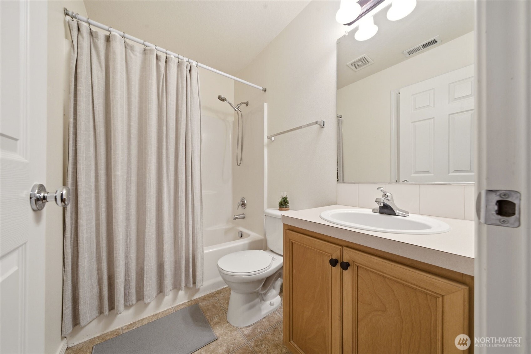1205 Northeast 165th Way Ridgefield, WA 98642 - Photo 27 of 38 a bathroom with a sink a toilet and shower
