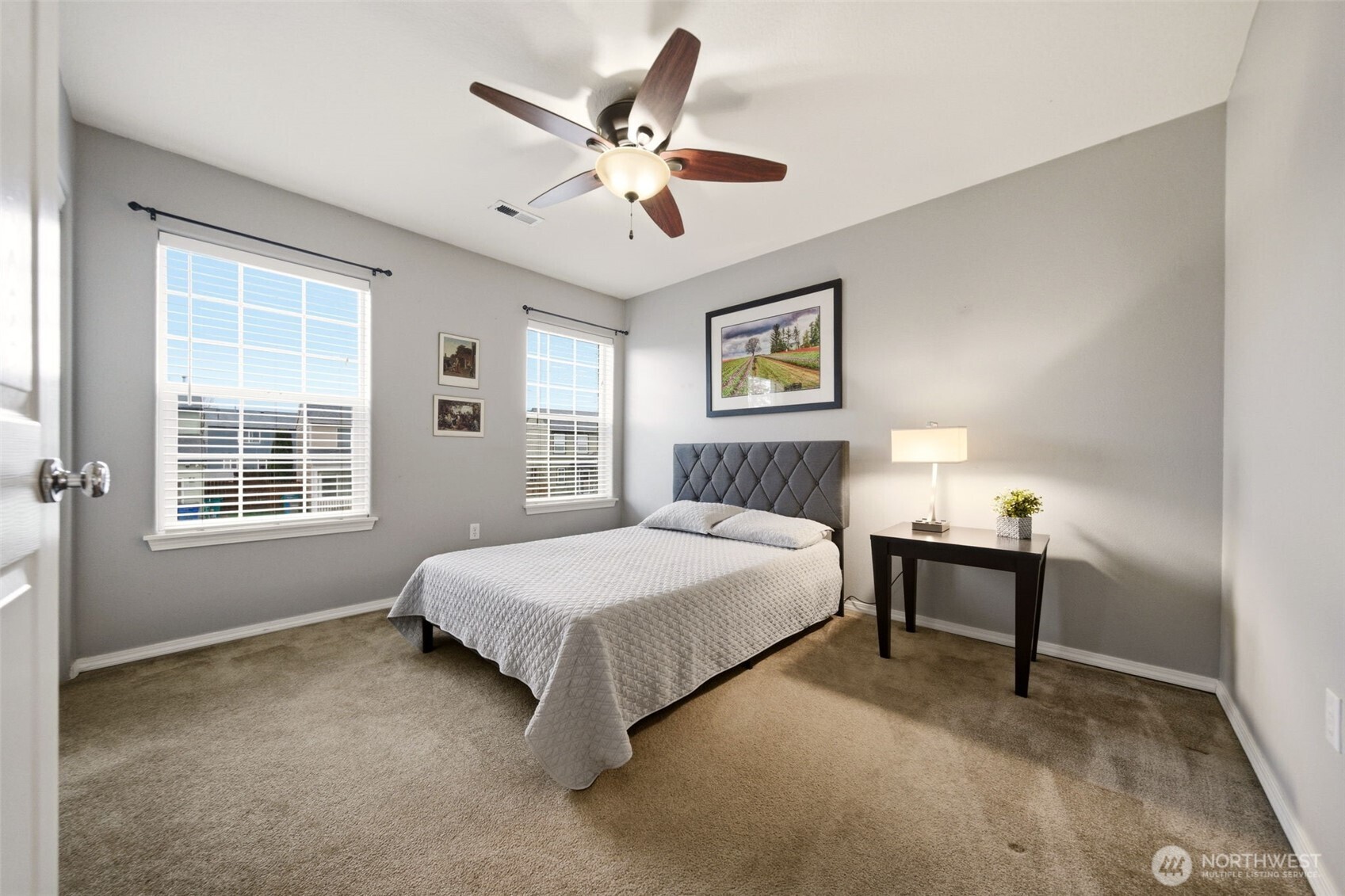 1205 Northeast 165th Way Ridgefield, WA 98642 - Photo 28 of 38 a bedroom with a bed wall painting and a window
