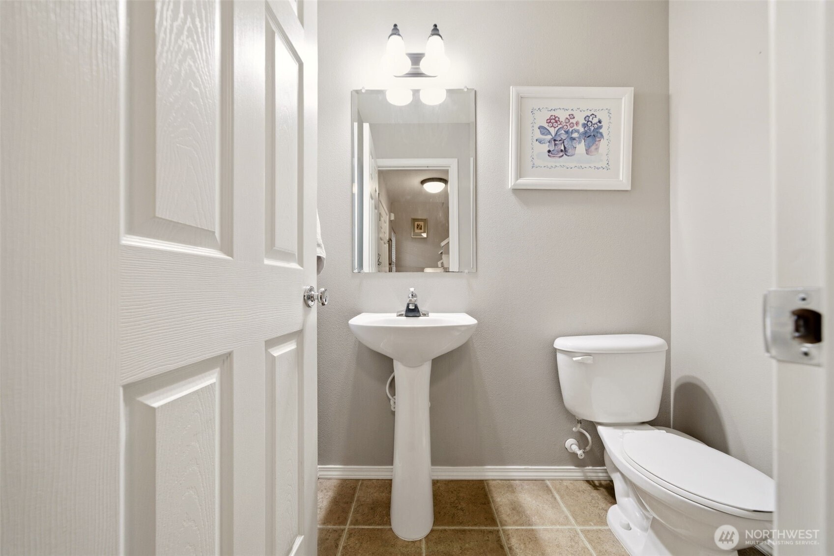 1205 Northeast 165th Way Ridgefield, WA 98642 - Photo 30 of 38 a bathroom with a toilet a sink and mirror