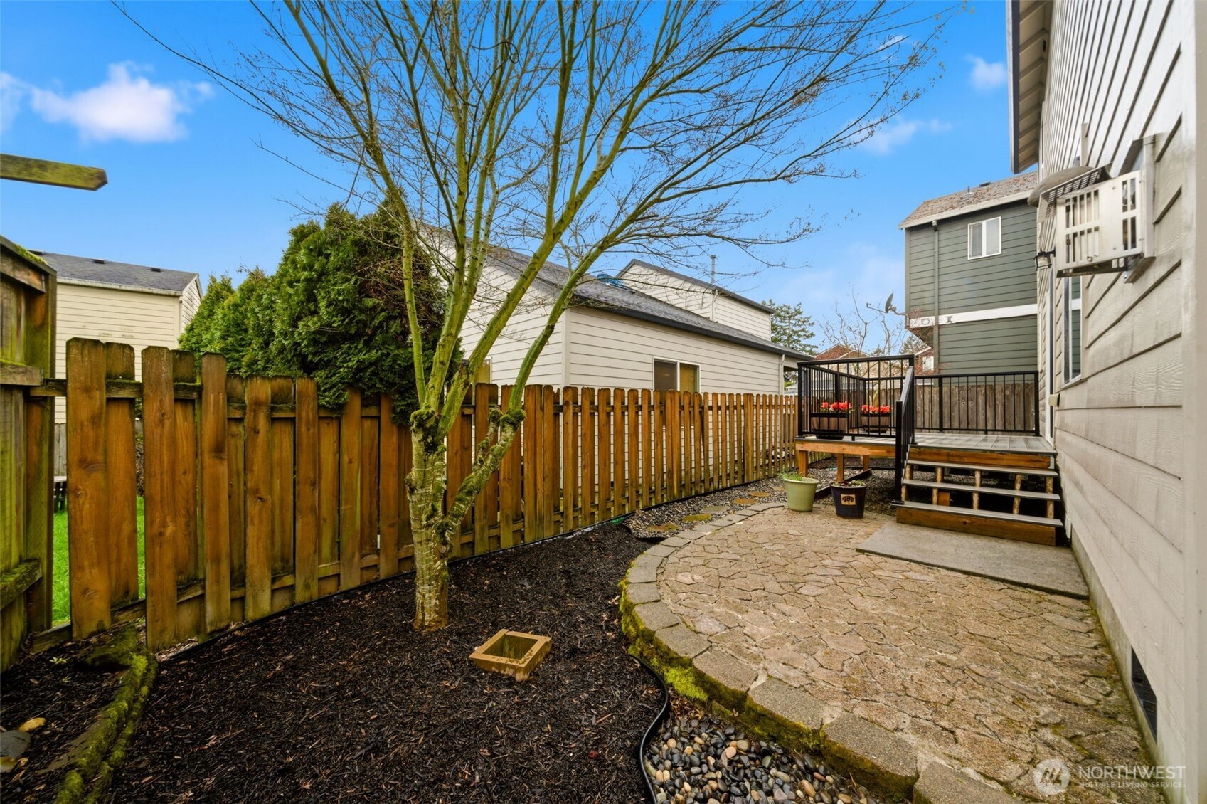 1205 Northeast 165th Way Ridgefield, WA 98642 - Photo 35 of 38 a backyard of a house with barbeque oven table and chairs