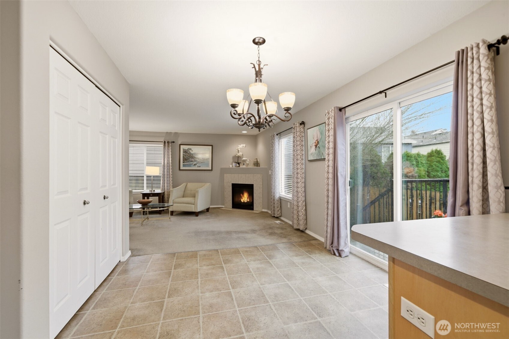 1205 Northeast 165th Way Ridgefield, WA 98642 - Photo 10 of 38 a view of a big room with windows and chandelier