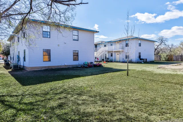 a view of a back yard of the house