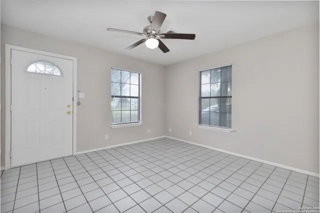 a view of an empty room and window