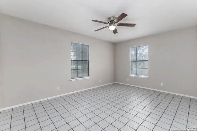 a view of an empty room and window