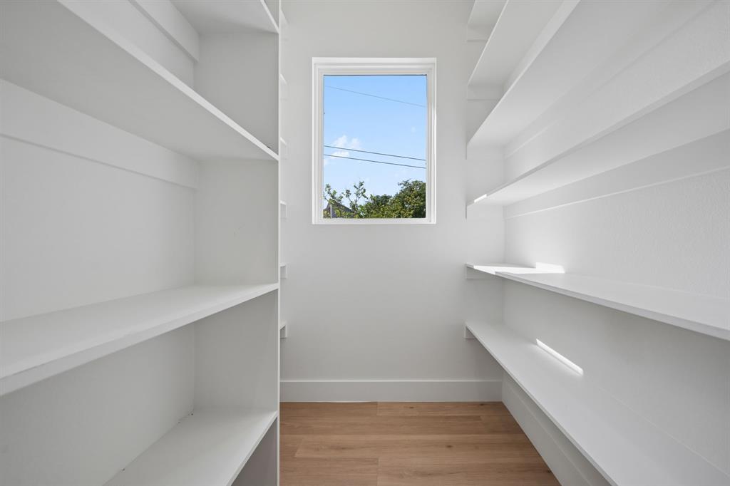 105 Buckboard Trail Oak Point, TX 75068 - Photo 11 of 27 Walk in pantry with light wood-type flooring