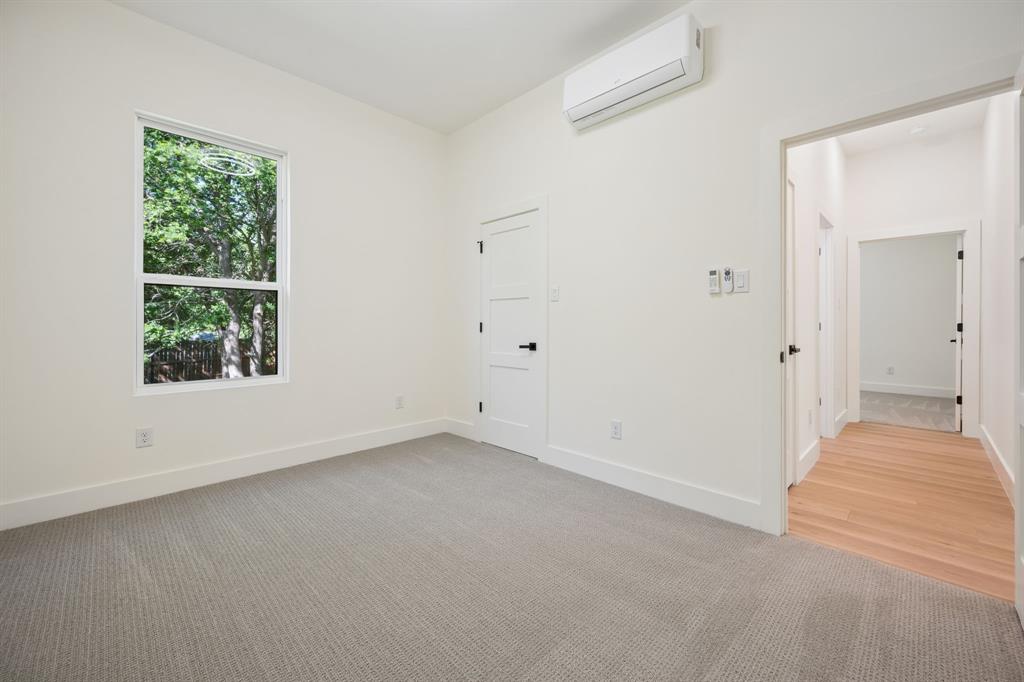 105 Buckboard Trail Oak Point, TX 75068 - Photo 19 of 27 First floor bedroom with light colored carpet.
