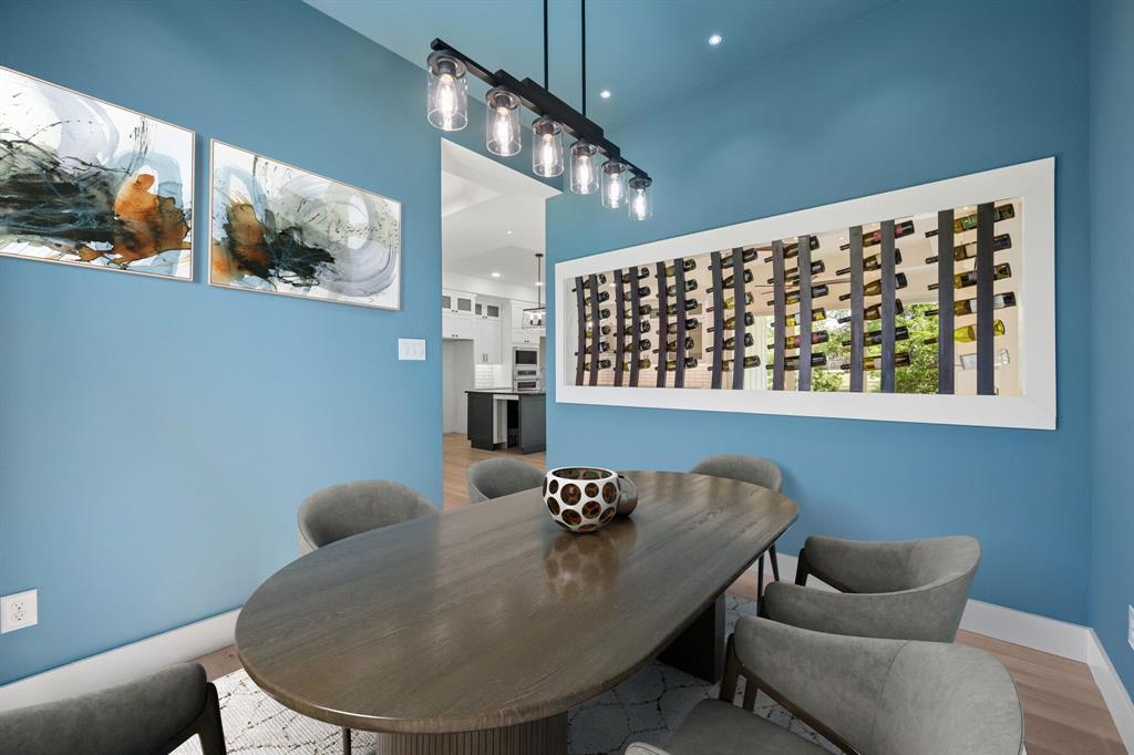 105 Buckboard Trail Oak Point, TX 75068 - Photo 2 of 27 Formal dining room with wine racks, virtually staged.