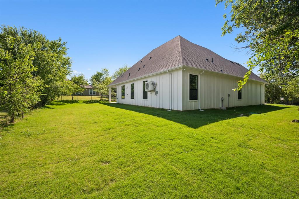 105 Buckboard Trail Oak Point, TX 75068 - Photo 23 of 27 View of side yard.