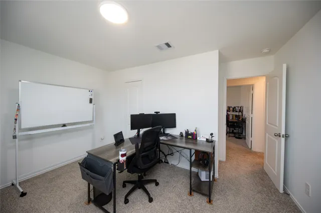 a view of a workspace with furniture