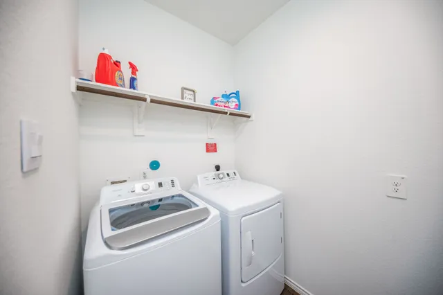 a utility room with dryer and washer
